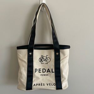 Pedal power tote. Two inside pockets, one w zipper. Same logo on both sides.